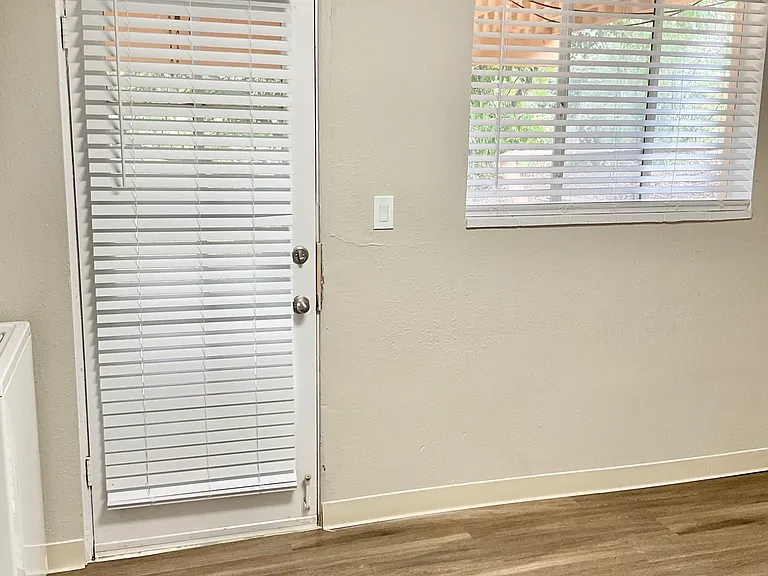 Experience the warmth of natural light and modern design in this charming corner space. Experience the warmth of natural light and modern design in this charming corner space.
