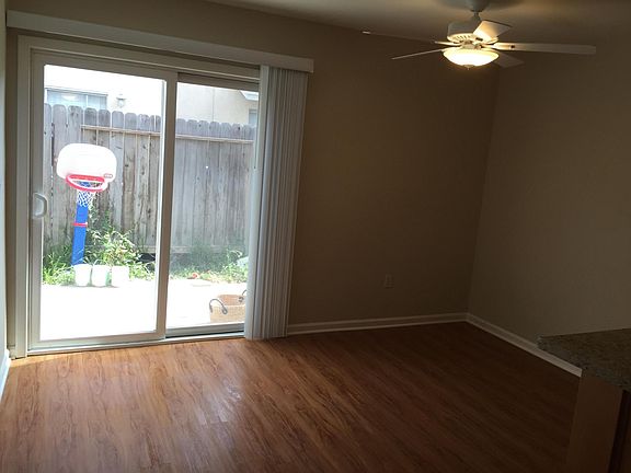 Dining area and private patio with gate to parking