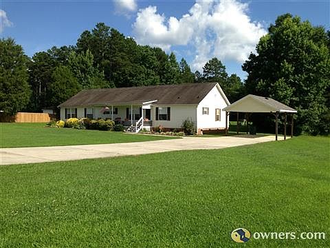 Front of House with Car Port