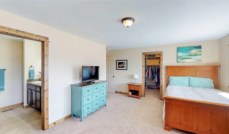 Master BR w/ an ensuite bath, a walk-in shower and closet.