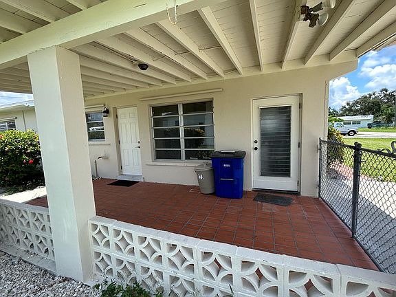Side of home: Door on the right is to the Laundry Room. Door to the left enters in the kitchen.