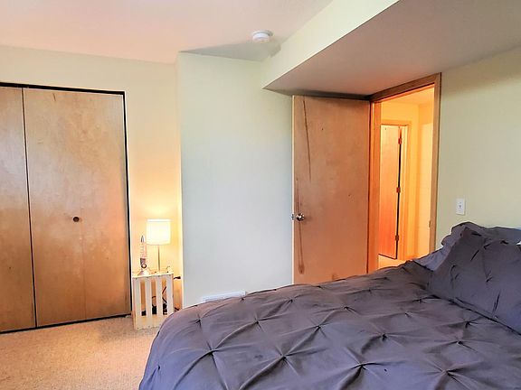 Lower level bedroom. (photo from neighboring unit but same layout)