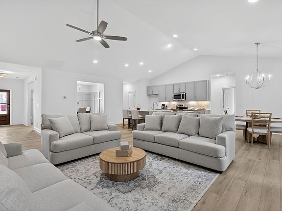 Open floor plan with cathedral ceilings