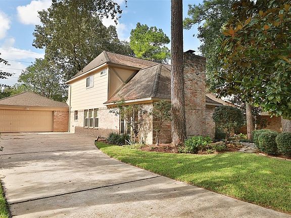Set back driveway with two car garage provides plenty of space for parking.