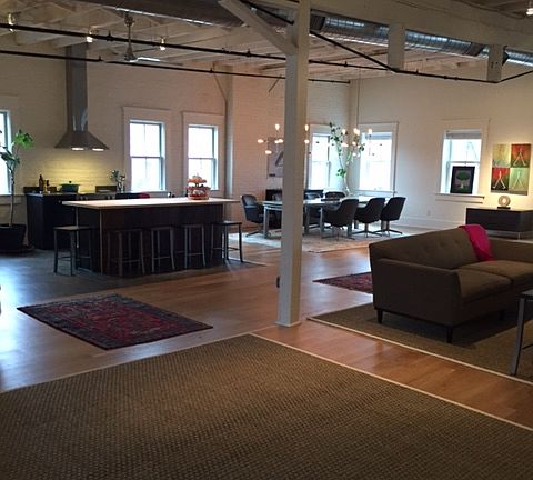 View when you walk into loft - kitchen, dining area and living space