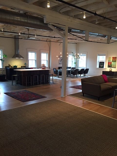 View when you walk into loft - kitchen, dining area and living space