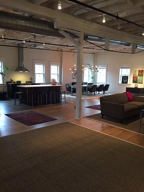 View when you walk into loft - kitchen, dining area and living space
