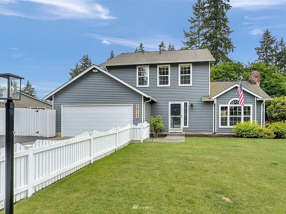 Charming picket white fenced Silver Firs home