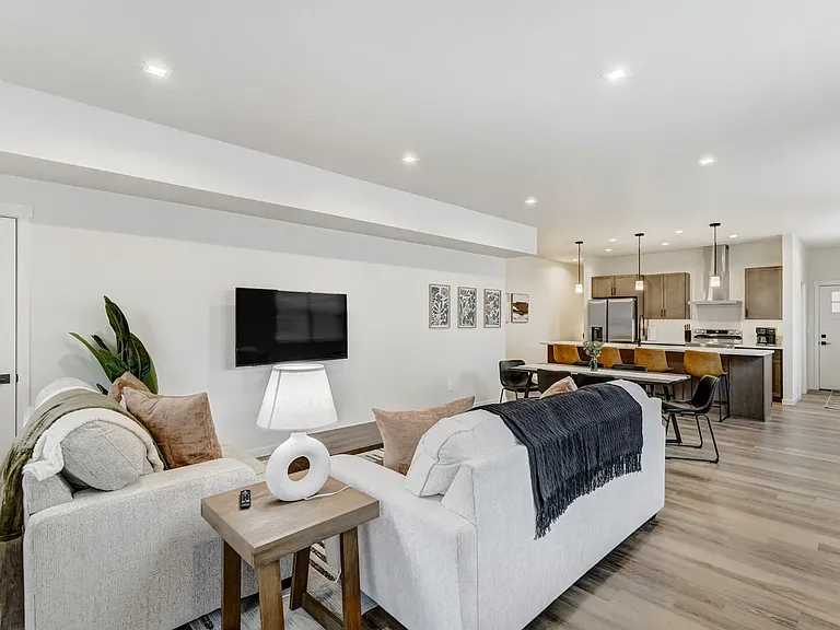 Living Space

Beautiful open-concept layout, featuring a spacious living room, fully equipped kitchen, and dining area.