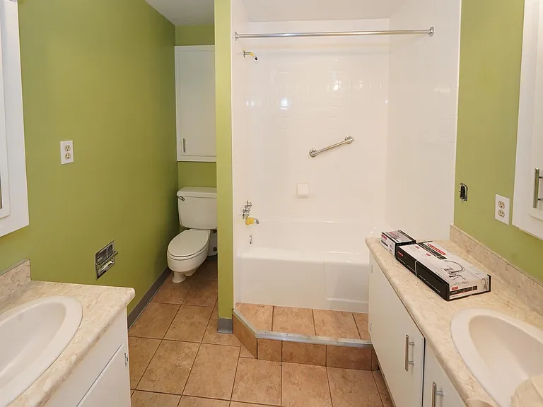 LARGE BATHROOM with double vanities, tub & shower
