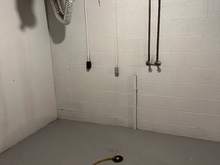 Washer and Dryer hook up, basement of townhome.