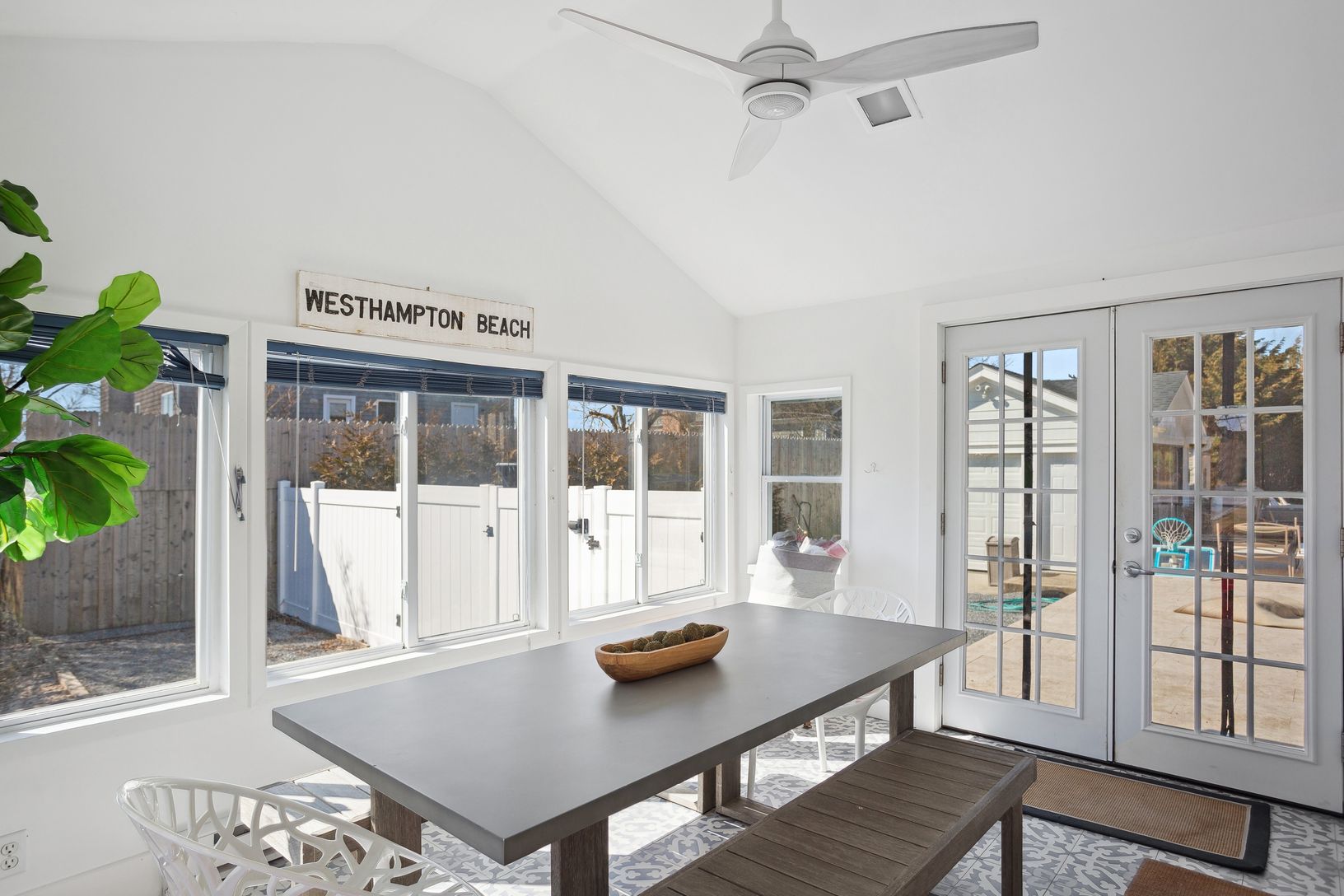  sun room acts as separate dining room overlooking pool