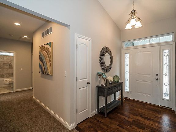 Another view of the Foyer and the hallway leading back to the Bedrooms.