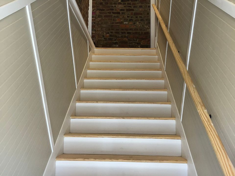 Stairs to both upstairs apartments. 201 is on the right.