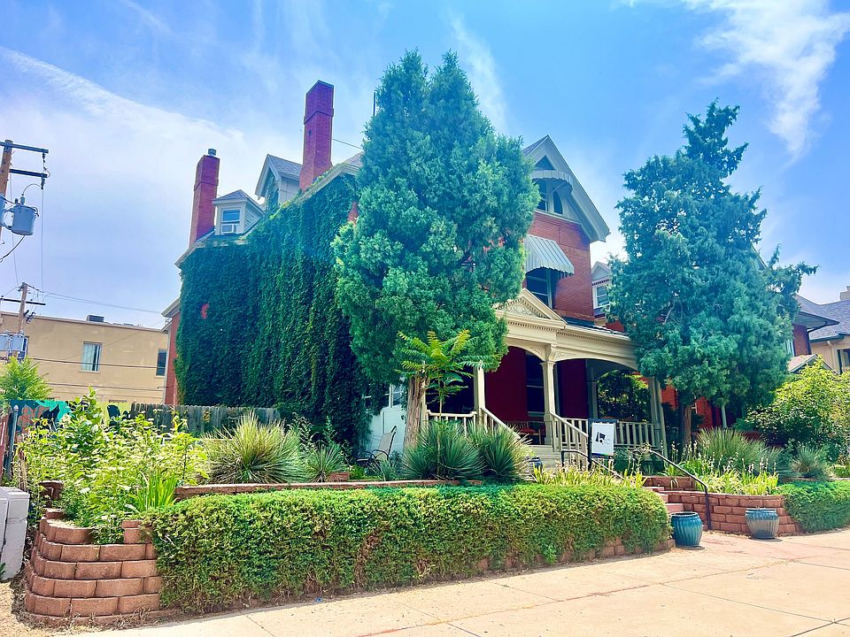 Explore the charm of this historic house enveloped in nature's embrace.
