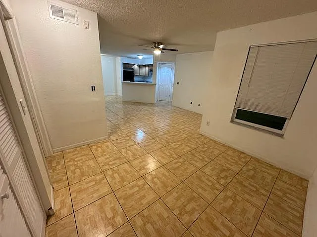 View of dining room, living room, kitchen from right side of unit towards left side.