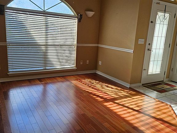 Dining area, sitting area, or office area near front door.