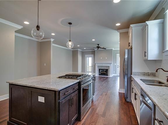 Entertainers dream kitchen. Jenn Air range in the center of the island so you can cook meals while conversing with guests.