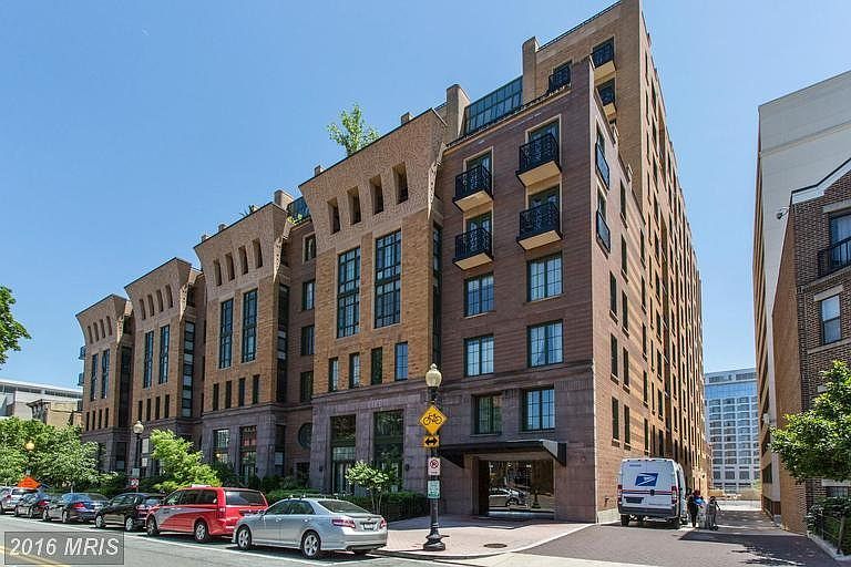 Building front. Unit faces out in this direction, getting good light and on a relatively quiet, one-way street.