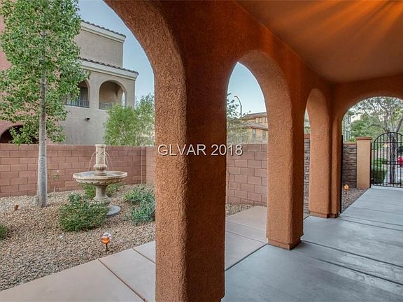 Tranquil Fountain and seating area at entry to home