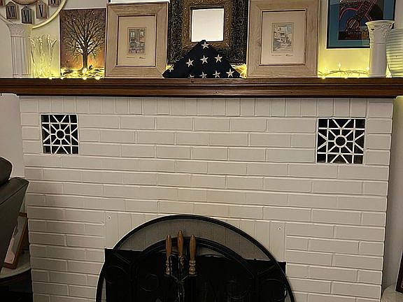 Wood brng brick fireplace