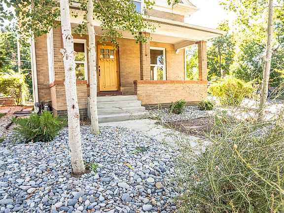 Beautiful front yard with spacious porch to enjoy summer days