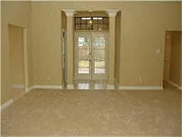 French doors lead to the study which could double as a play or hobby room