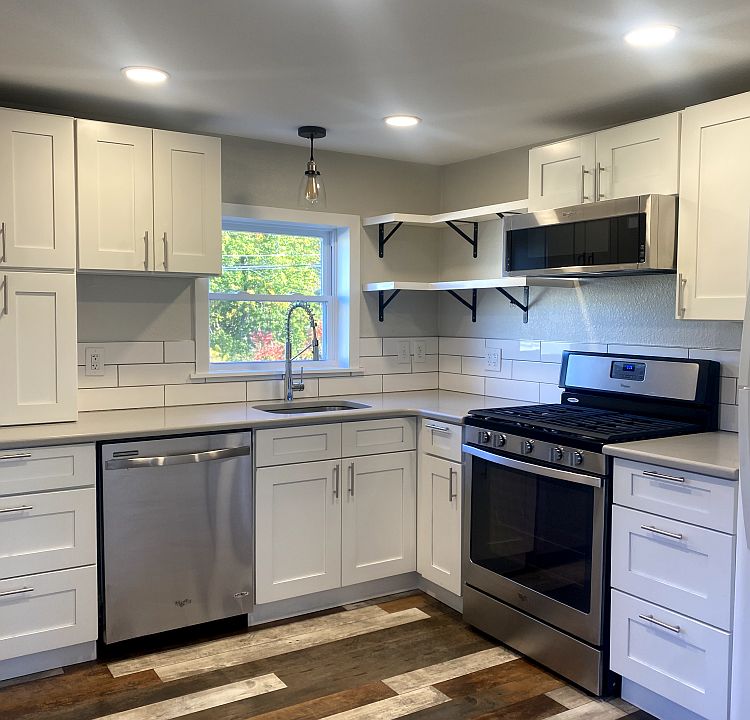 Modern farmhouse kitchen with stainless steel appliances