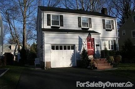 Front of House : Professional landscaping and canopy tree work.