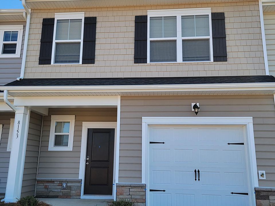 Front elevation. The property is directly opposite community pool.
