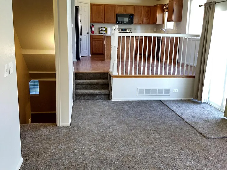 View from living room to kitchen and basement