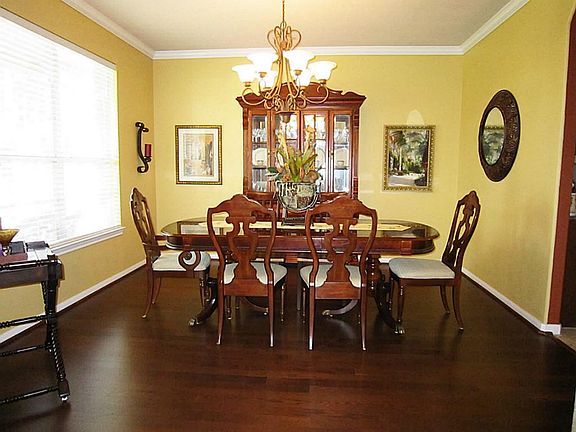  Formal dining room upon entry-features rich wood floors that continue throughout the first floor.