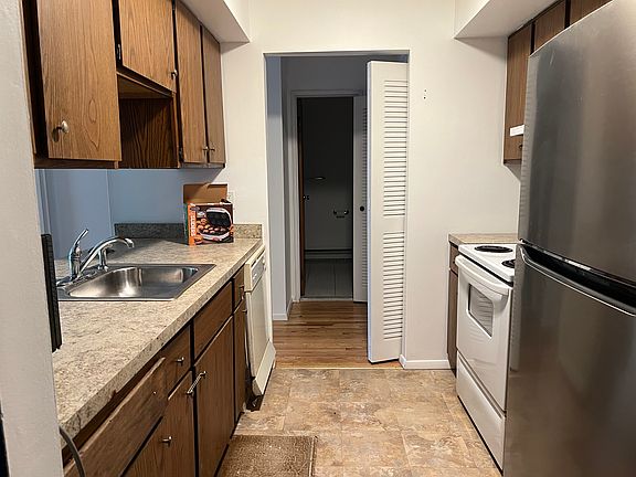 Kitchen with opening to living room between the cabinets