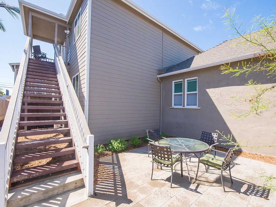Unit is up the stairs. Down below is a common, fenced patio.