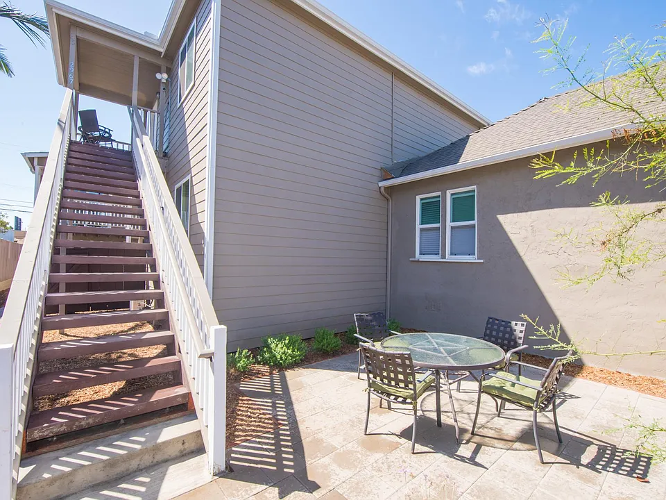 Unit is up the stairs. Down below is a common, fenced patio.