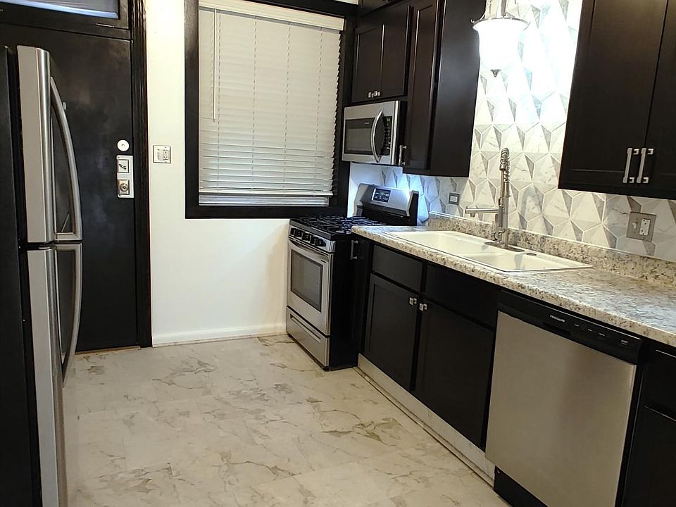Kitchen with stainless steel appliances.