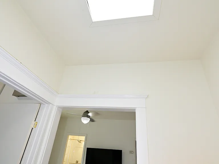 hallway has bright skylight