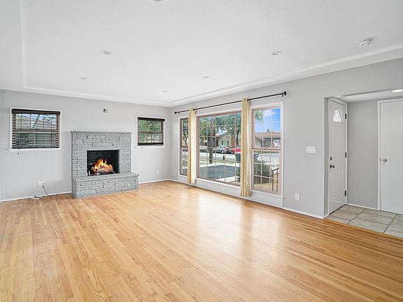 Living room. hardwood floors. Coat closet, electrical above fireplace for TV. The fireplace is not operable.
