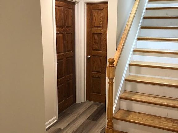 stairs and doorway to front bedroom and interior bedroom