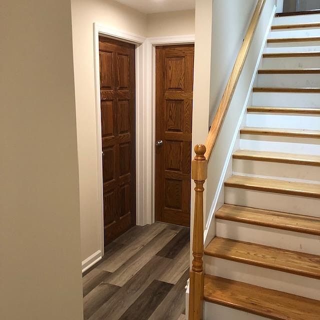 stairs and doorway to front bedroom and interior bedroom