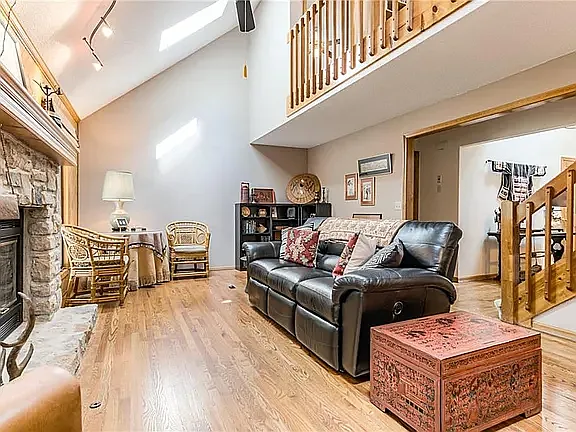 Main-level family room with second floo balcony hall to bedrooms