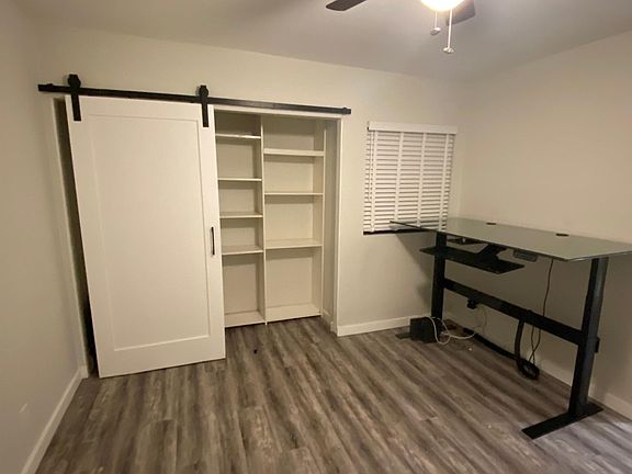 Removed old closet door and added barn door. All shelves customizable