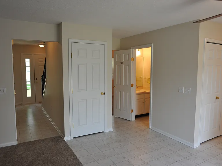 First floor hallway, basement entry, half bath