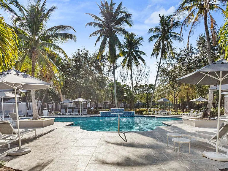 Relax by the pool with ample lounge seating, perfect for soaking up the sun or enjoying the view.
