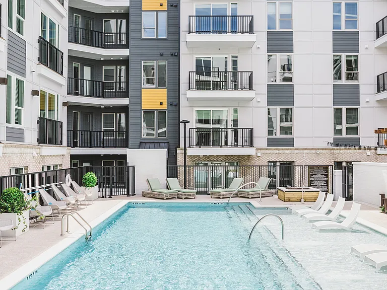 Resort-style pool with sunledge