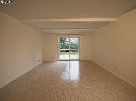 Living Room Features Access To Entertaining Deck & Private Backyard!