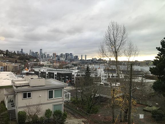 View of Space Needle, Downtown, and Lake Union from living, dining, and balcony