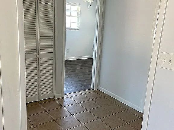 Hallway to bedrooms and linen closet