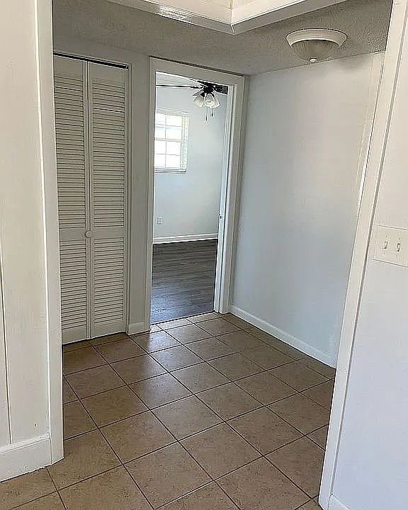 Hallway to bedrooms and linen closet