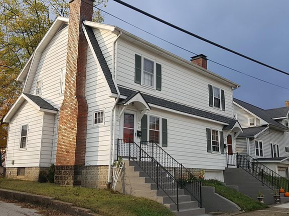 Front and side of duplex, available unit is on left